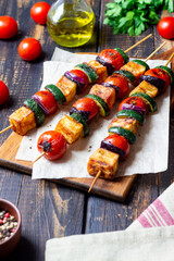 Grilled skewers with halloumi cheese, zucchini, tomatoes and onions. Kebab. Healthy eating. Vegetarian food.