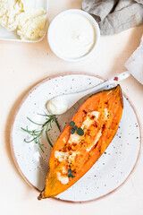 Baked sweet potatoes with mozzarella, herbs and creamy dip.
