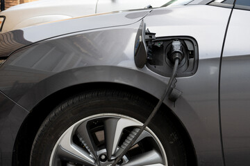 The process of charging an electric car close up