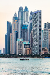 Obraz na płótnie Canvas Dubai jumeirah beach with marina skyscrapers in UAE at sunset.