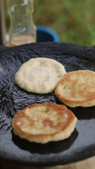 Street hawker preparing prata bread or roti canai for morning breakfast