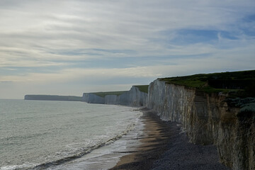 Cascade of beautiful rocks on the ocean. Evening rocks in the ocean. Huge impressive rocks at dusk.