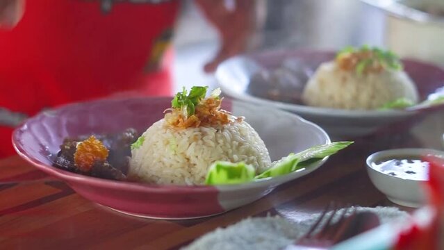 Buffalo meat with rice. The meat is stewed and topped with rice