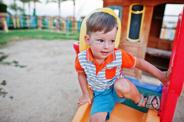 Fototapeta na wymiar Boy at playground of egyptian resort.