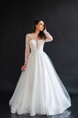 Naklejka premium portrait of beautiful bride in wedding dress with fashion hairstyle and make-up