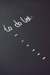 To do list writen in white against a black blackboard