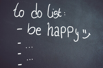 Fototapeta na wymiar Motivational image about happiness as the most important thing in a to do list