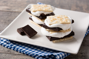 Homemade smores on wooden table. typical American sweet	