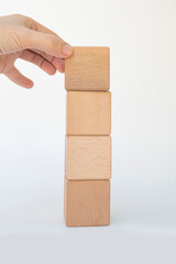 hand holding wooden blocks