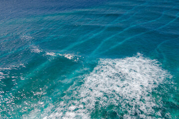 Aerial view of big turquoise wave of Indian ocean in Maldives. Exotic tropical landscape from above. Summer holiday or vacation travel concepts