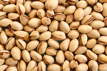 close up of unshelled pistachio nuts