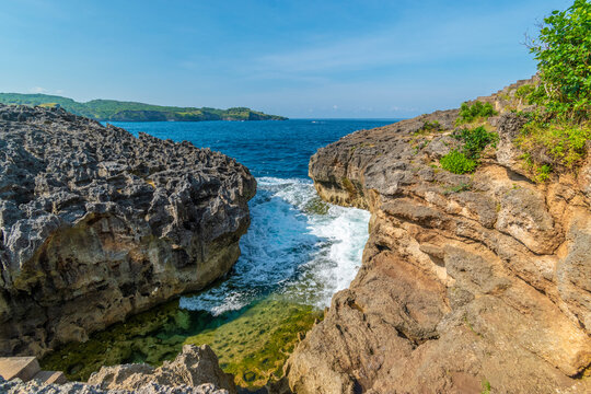 Beautiful crystal water view of angel bilabong in nusa penida island with rock beside it, bali, indonesia