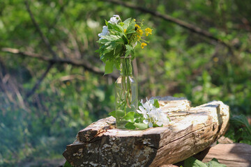 Transparent water bottle with a beautiful bouquet of flowers