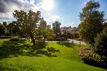 View on Alexander Garden and beautiful Pashkov House. Blue sky, clouds and sun. Moscow, Russia.