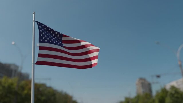 Flag of the United States waving in blue sky. 3D render.