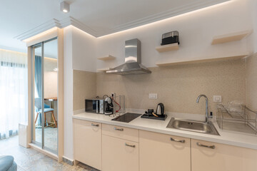 Kitchen interior in modern hotel apartment