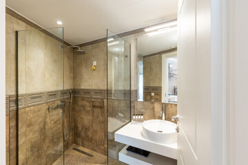 Fototapeta na wymiar Interior of a luxury bathroom glass shower cabin