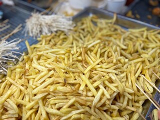 French fries, chips (British English),finger chips, french-fried potatoes, or simply fries, are batonnet or allumette-cut deep-fried potatoes, possibly originating from France. 