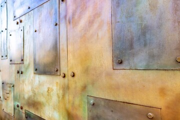 Background with metallic coating and bolts