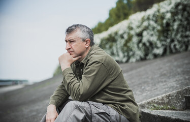 Mature European man with a sad philosophical mood. The concept of life after 50 years, problems and...
