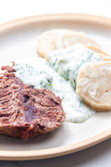 beef meat with dill sauce and dumplings