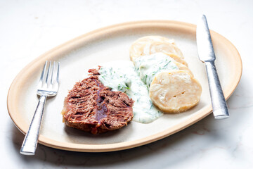 beef meat with dill sauce and dumplings