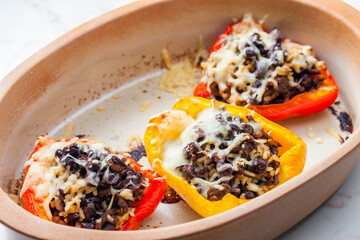 baked peppers filled with minced meat, rice, beans and cheese