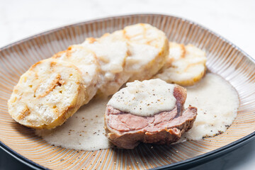 meat with creamy pepper sauce and karlsbad dumplings