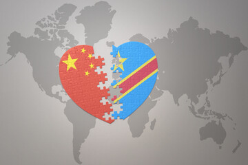 puzzle heart with the national flag of china and democratic republic of the congo on a world map background. Concept.