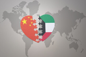 puzzle heart with the national flag of china and kuwait on a world map background. Concept.