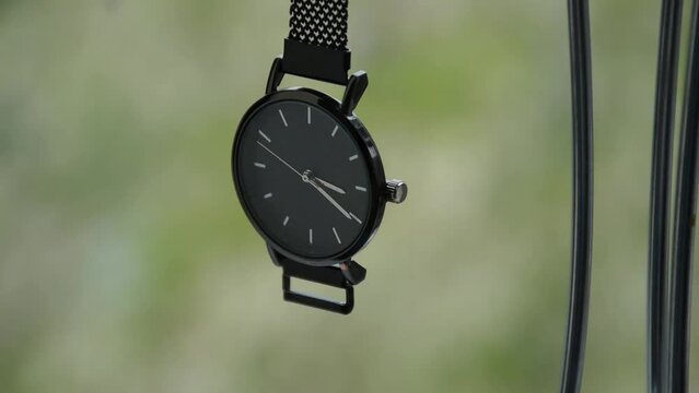 Elegant wrist watch. Close-up on a blurred background.