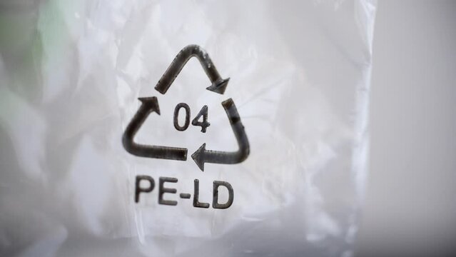 4k Closeup view of ldpe 04 recycle sign or label on white packaging spbd. Low density polyethylene is flexible plastic with many applications. Historically, it hasn't been accepted through most