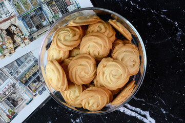 close up cookies in glass jar in marble background