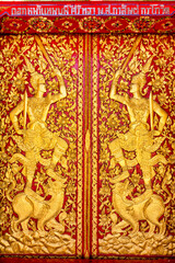 Fototapeta na wymiar Ornate door in Wat Mo Kham Tuang