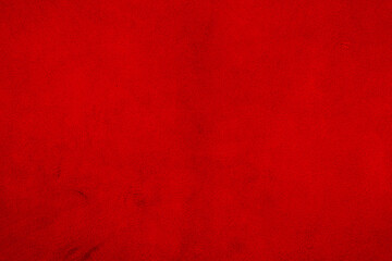 Red matte background of suede. Velvet texture of seamless leather. Red suede texture.