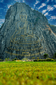 Buddha Mountain a biggest image of Buddha engraved on the rock. Thai text below: created in 1996, buddha's name is Phra Puttha Maha Wachira Uttamopat Satsada.
