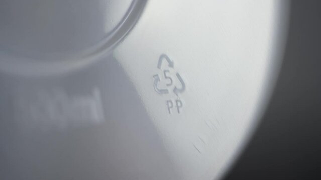 4k Close view of 5 PP recycling badge or label on white plastic packaging spbd. Polypropylene has high melting point, so it's often chosen for containers that will hold hot liquid. It's gradually