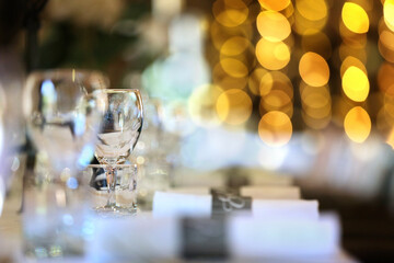 Formal wedding place setting on long table background