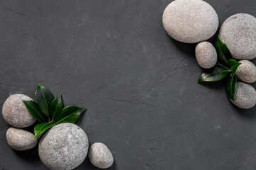 Spa stones for massage with leaves for beauty therapy