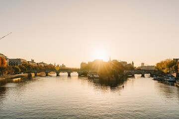 Naklejka premium Sunrise in the heart of Paris with Ile de la Cite and Pont Neuf