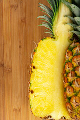 Yellow Ripe ripe pineapple on wooden background