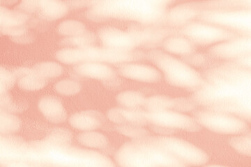 Light and shadow pink pastel abstract background. Natural leaves shadows and sunshine diagonal...