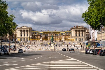 Fototapeta na wymiar The Versailles castle and its royal avenue palace outside Paris France during the day