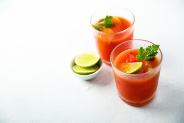 Homemade tomato cocktail with fresh lime