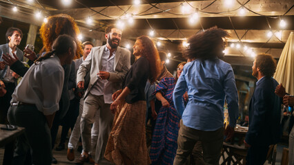 Beautiful Carefree Friends are Dancing Together and Celebrating an Evening Event at a Party ....
