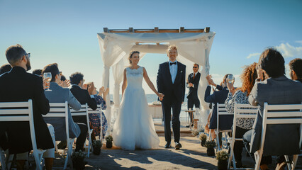 Beautiful Bride and Groom During an Outdoors Wedding Ceremony on an Ocean Beach. Perfect Venue for...