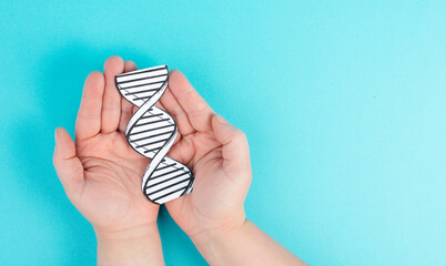 Holding a DNA strand in the hand, genetic therapy and treatment, biotechnology in mordern medicine,...
