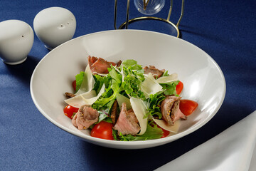 Plate with salad in restaurant