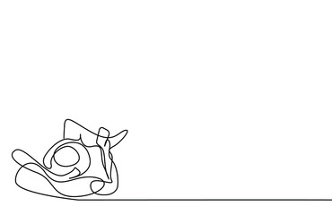 a person is lying on the beach on the floor in a tatail and reading a book and using a phone