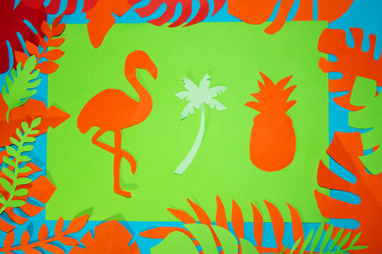 paper flamingo palm and pineapple on a green background, around tropical leaves, jungle design